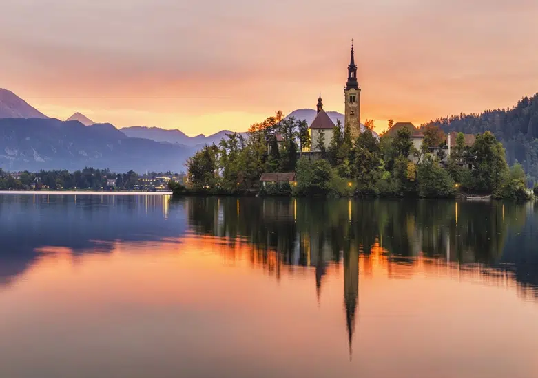 beautiful, multicolored sunrise over an alpine lake Bled in Slovenia