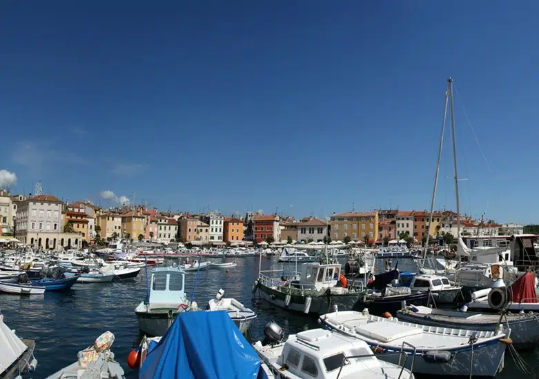 Panoramic landscape with the sky, the sea and the port city of Porec, Croatia