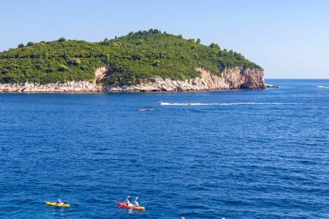 View of Lokrum Island with sea kayakers
