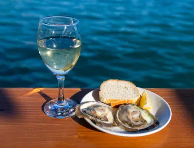 Oyster tasting in Ston Croatia with a glass of white wine